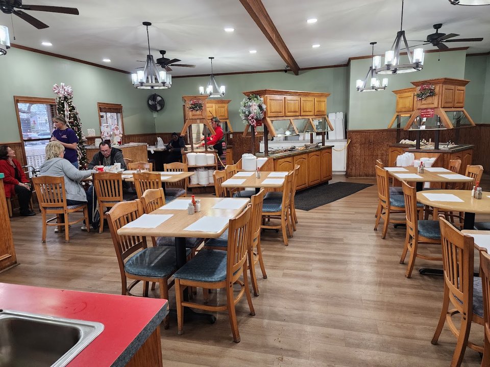 Lunch plates beside a salad bar